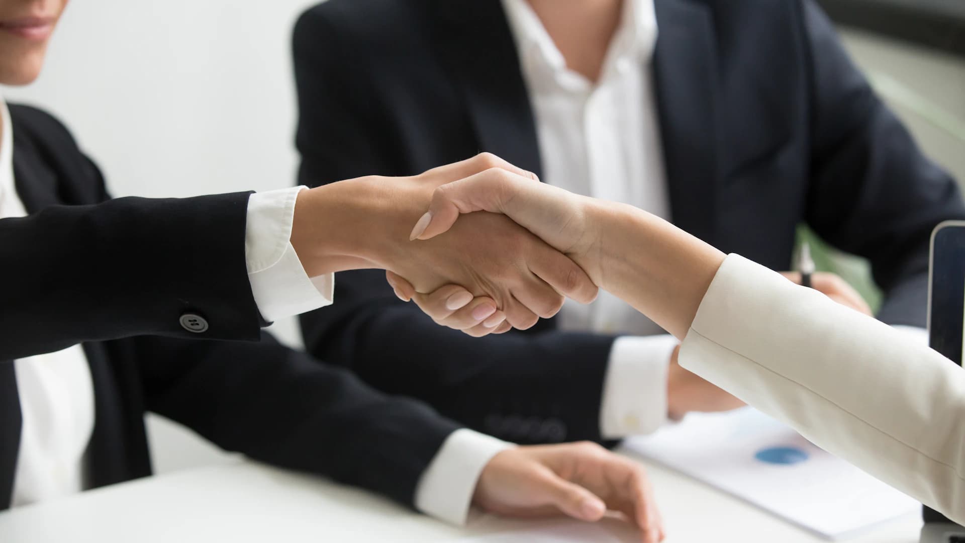 Business partners shaking hands after a successful agreement