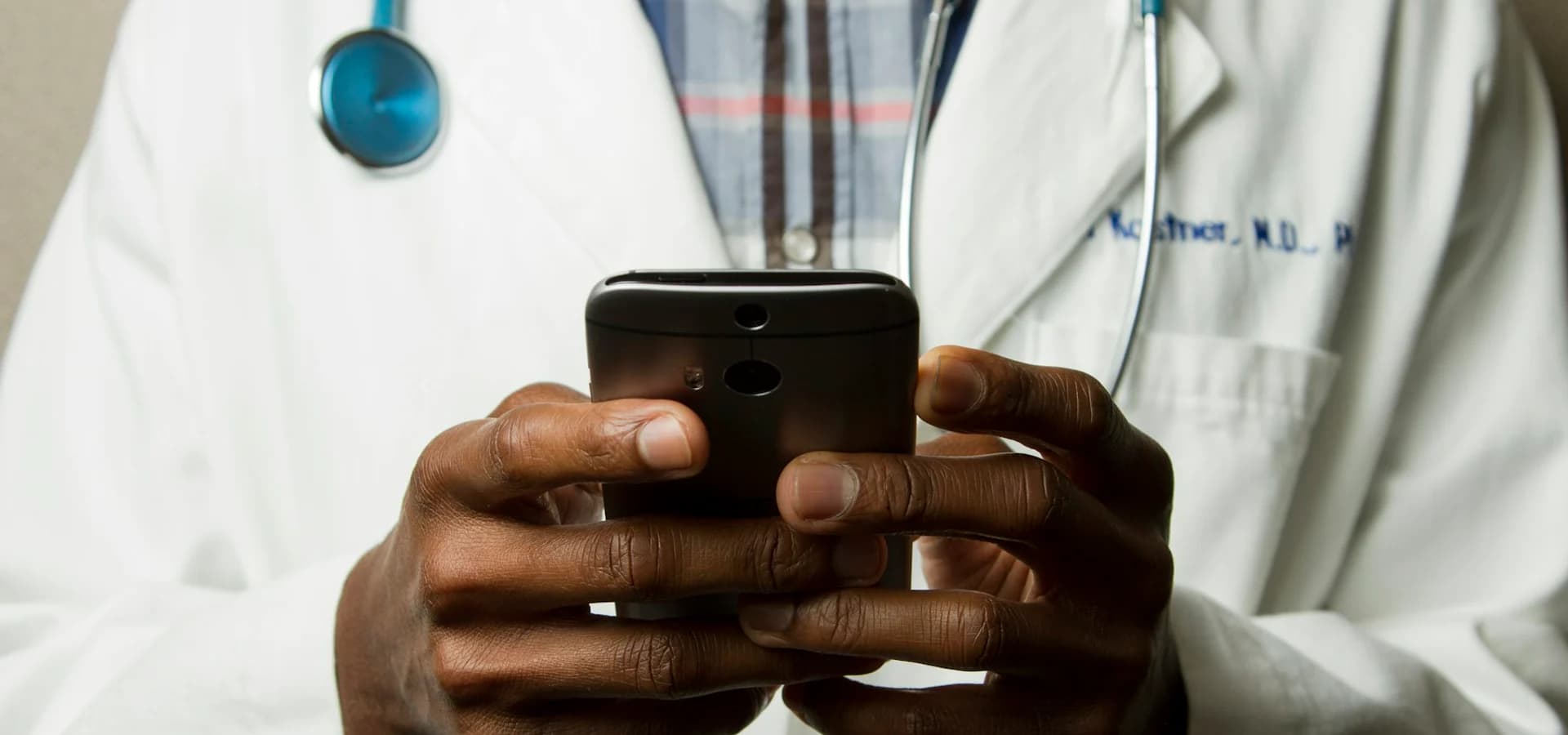 A healthcare professional using a mobile device