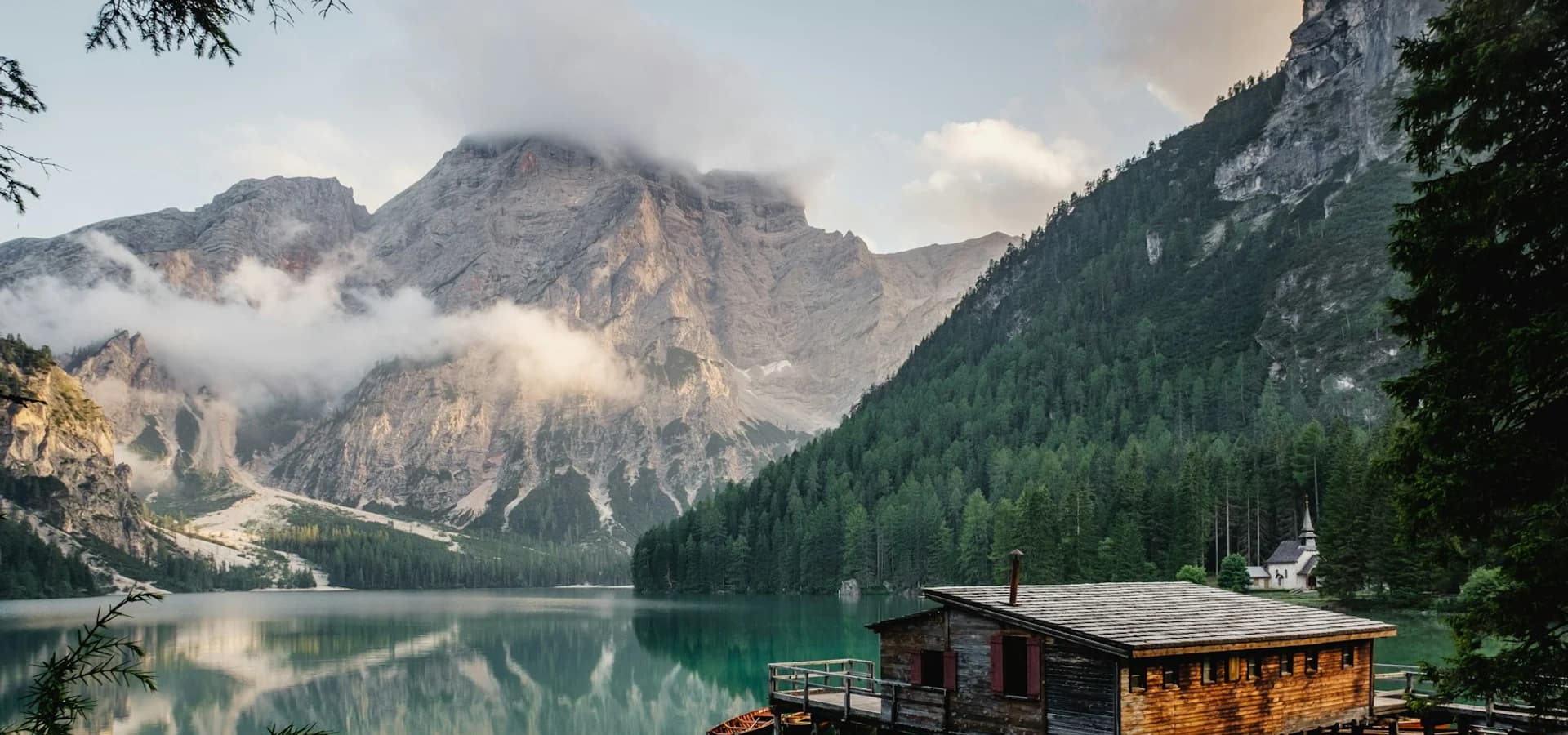A clear mountain lake surrounded by a natural landscape