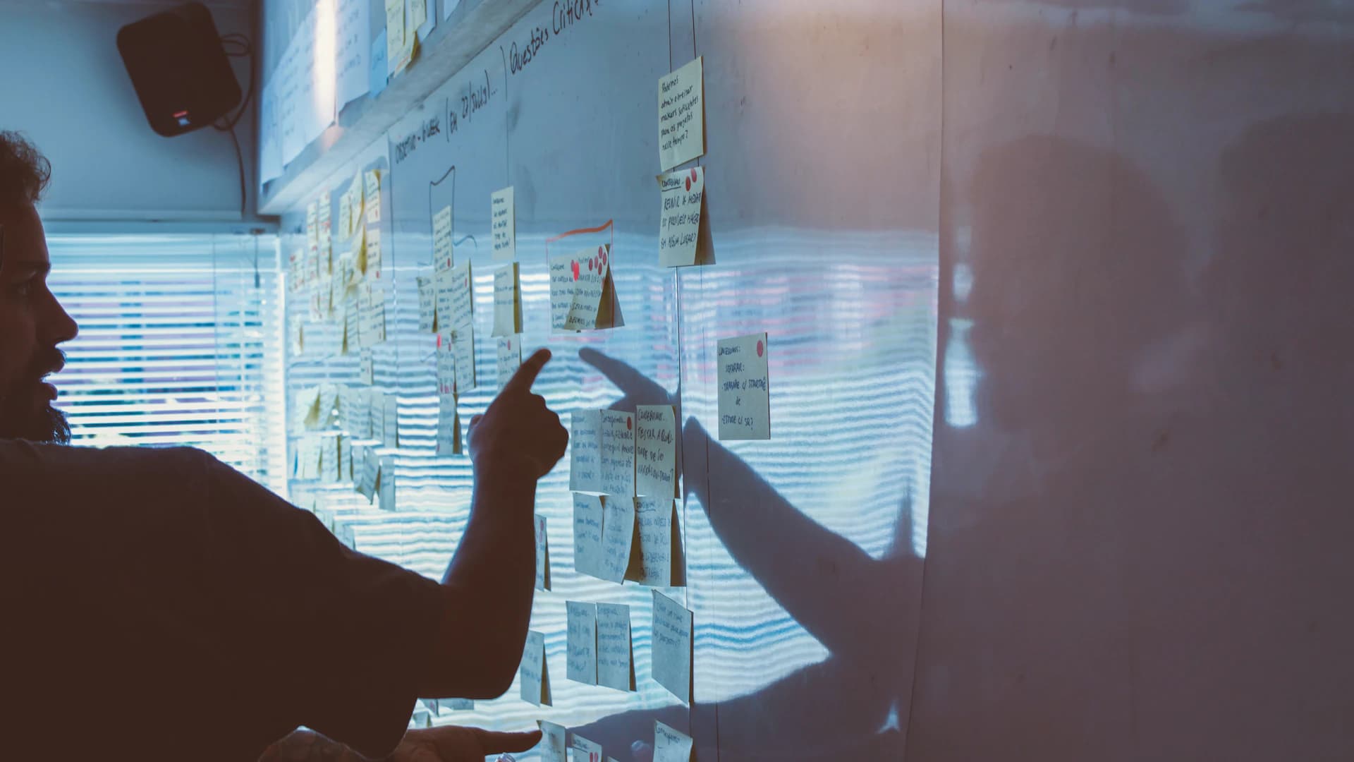 Business leaders shaping a strategy with plans and notes