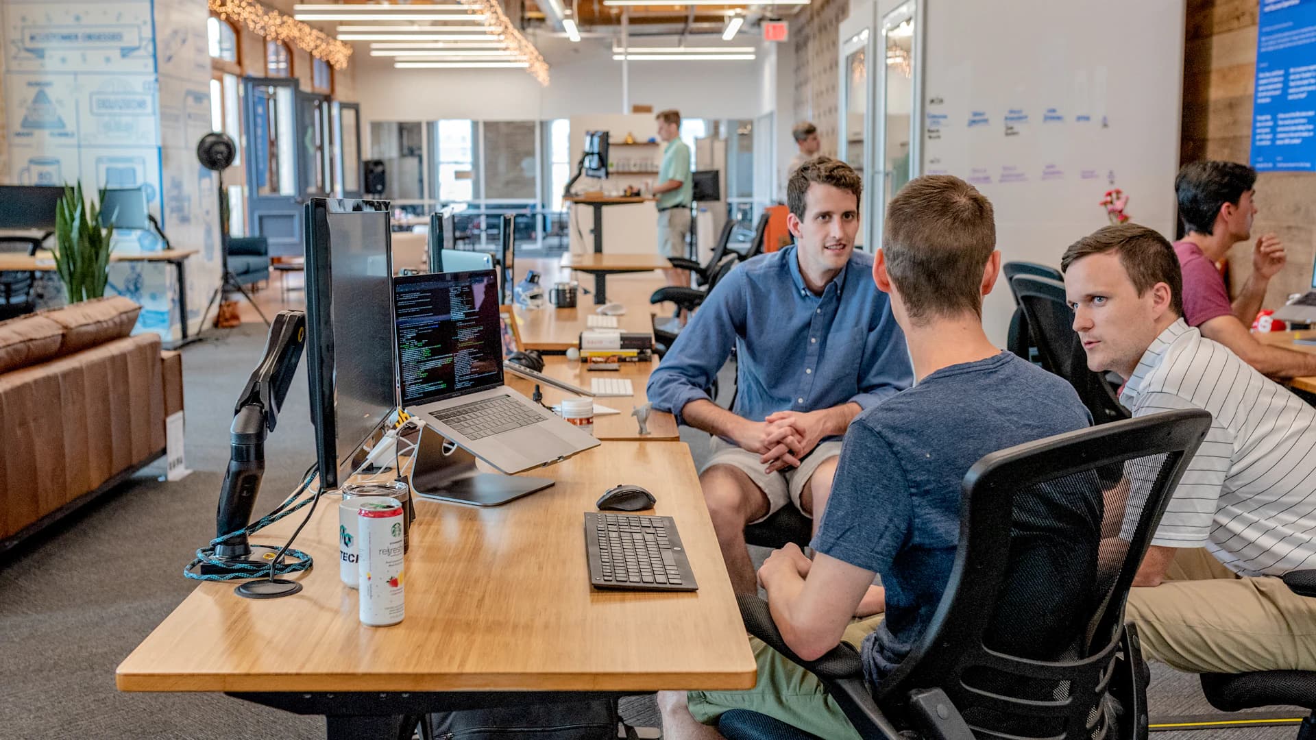 Colleagues exchanging ideas in a modern collaborative workspace